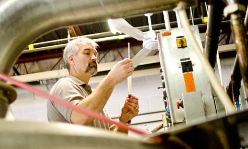 brewmaster andrew kohnen analyzing beer during fermentation and production